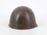 a helmet that is sitting on a white surface