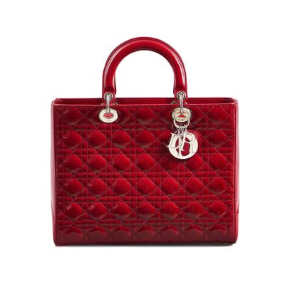 a red handbag with a metal handle on a white background