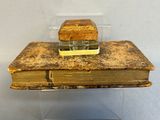 an old book with a piece of bread on top of it