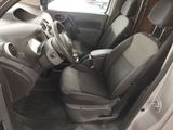 the interior of a car with the door open and the driver ' s seat down