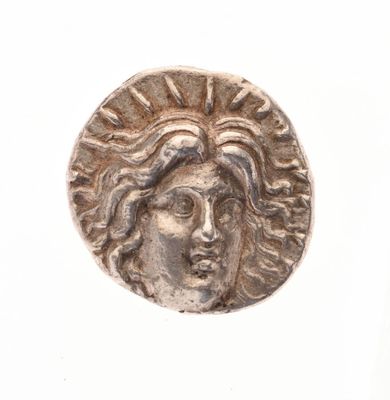 l'image d'une pièce d'argent sur laquelle figure le visage d'une femme