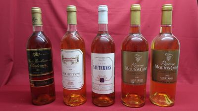 six bottles of wine are lined up in a row on a pink background