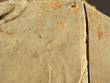 a piece of fabric that has been torn off of it