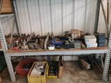 many tools on a shelf in a garage