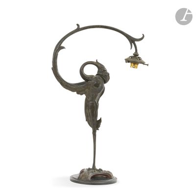 an image of a bronze statue of a woman holding a lamp