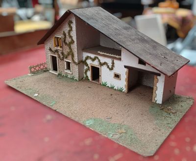 a small model of a house on a table