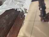 a piece of paper on the edge of a wooden table
