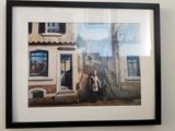 a picture of a woman standing in front of a building