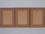 three empty cardboard boxes are sitting on top of a white surface