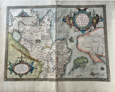 un vieux livre sur lequel figurent une carte et une boussole