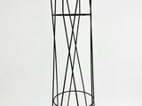 a metal coat rack with a bunch of coat hooks on it