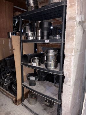 pots and pans on a shelf in a room