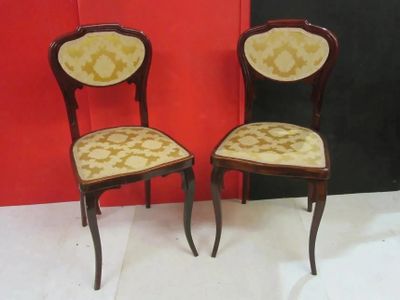 pair of antique chairs with upholstered upholstered backs