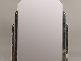 an image of a mirror with a metal frame and a mirror in the middle
