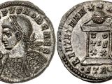 a silver coin with an image of a woman on it