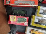 many different types of toy trains on the table