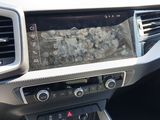 the dashboard of a car with a digital display in the center