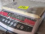 a cake sitting on top of a scale on a table