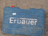a blue tool box that is sitting on the ground