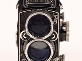 an old rolleilex camera on a white background with a white background