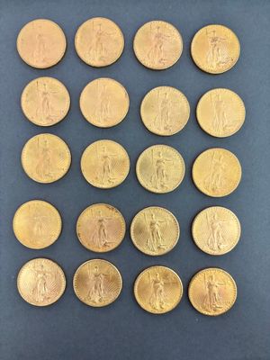 a close up of a bunch of gold coins on a table