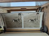 a picture of a man and a woman in the water in an open suitcase