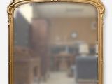 a mirror that has a picture of a woman on it
