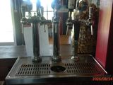 a picture of a beer machine with a lot of bottles