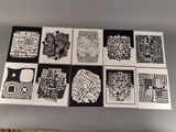several black and white cards with different designs on them