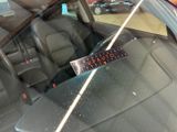 a sticker on the windshield of a car that is broken
