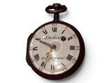 a clock that has roman numerals on the face of it