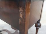a wooden table with a drawer on top of it