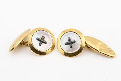 a pair of gold and mother of pearl cufflinks