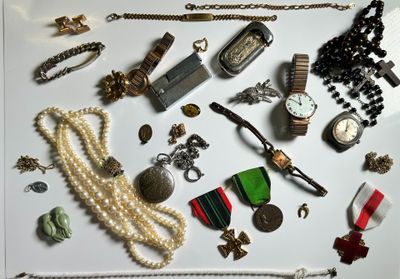 many different types of jewelry on a white surface