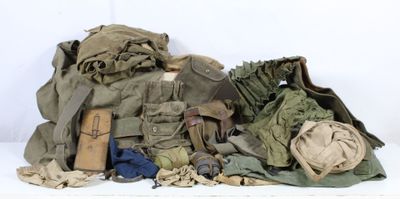 a pile of military items sitting on a white surface