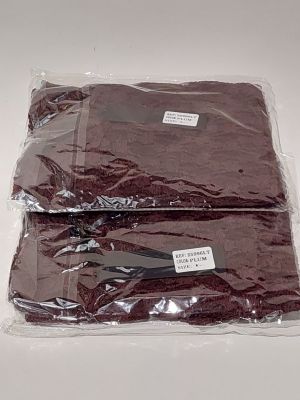 two pieces of cloth wrapped in plastic on a table