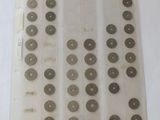 several different types of coins are displayed on a white surface