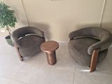 two chairs and a table in a living room