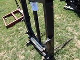 a table that is sitting in the grass near a chair