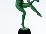 an image of a green statue of a man on a pedestal