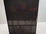 a picture of a black plastic box on a white table