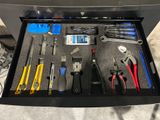 a drawer full of tools that are sitting on the floor