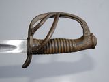 a close up of a sword that is on display