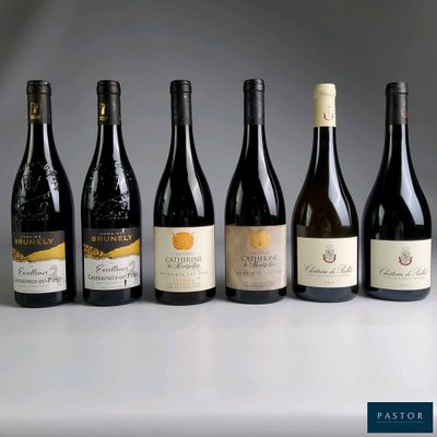 several bottles of wine are lined up on a table