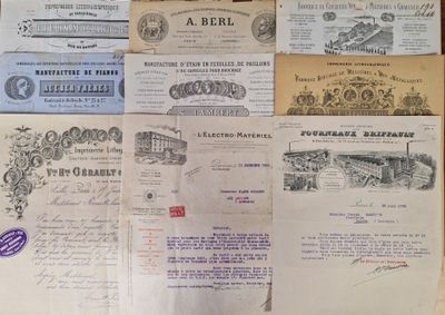 several old papers are stacked on top of each other on a table