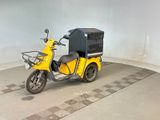 a yellow scooter with a black box on the back of it