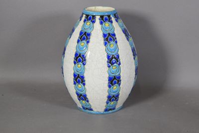 a blue and white vase sitting on a table