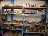 many tools on the shelves in the garage