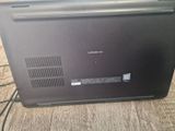 a laptop that is sitting on the floor with wires