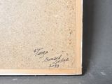 an old book with a black and white drawing on it